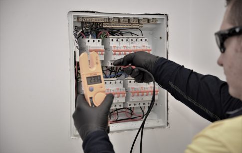 Orion electrician testing an electrical switchboard